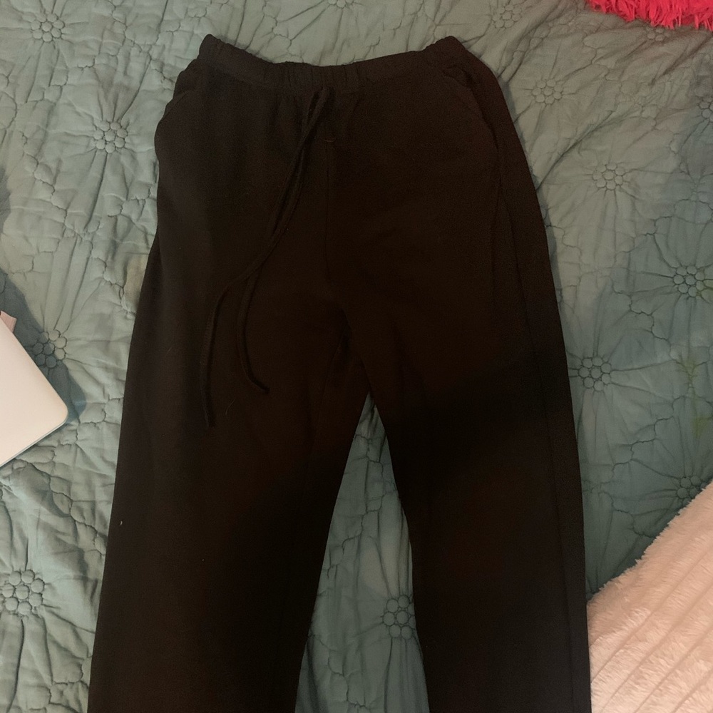 black joggers with saying on back